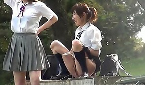 Immature Asian school girls play with piss