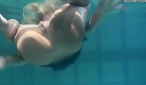 Blonde Feher with big firm tits underwater